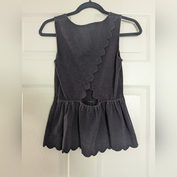 Chic Black Sleeveless Peplum Top - Picture 2 of 6
